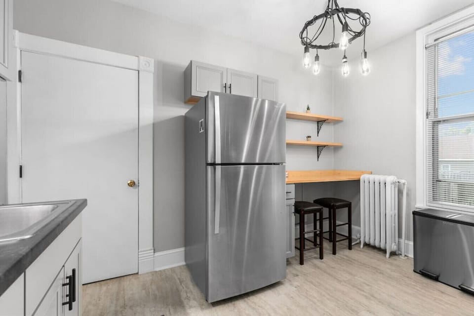 An eating bar and stools are an option if you want a quick bite instead of a sit down meal at the table.