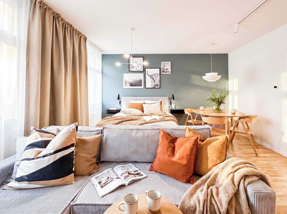 Living room with queen size bed and convertible sofa which allows to accommodate up to 8 people in the apartment.
