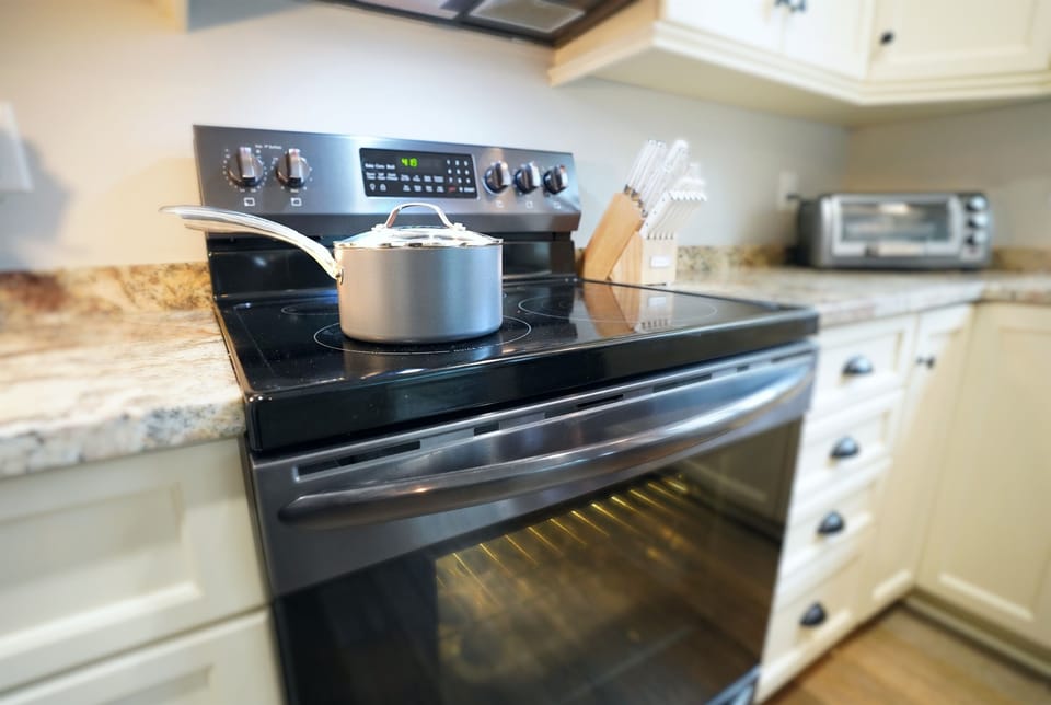 Pots, pans, and oven close-up.