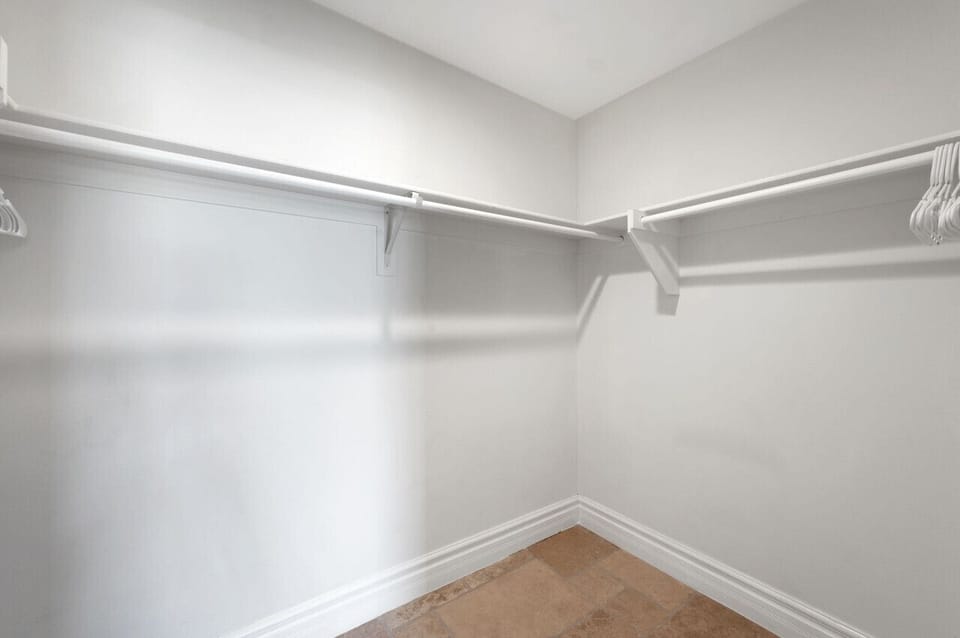Walk-in closet w/ shelving & hanging space to keep everything organized