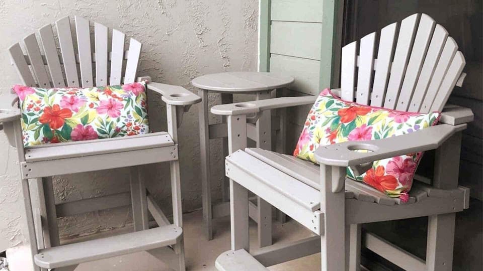 Enjoy mountain views while sipping coffee on vibrant, cushioned chairs!