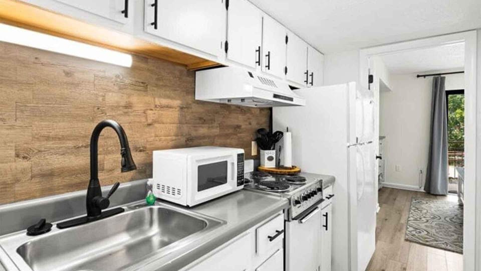 Super chic new kitchen with oven, frig microwave, and coffee maker