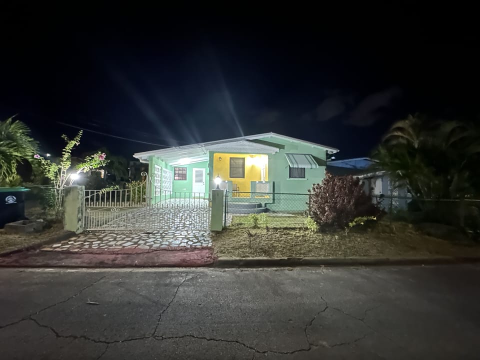 Outside view - corner home with porch and back patio