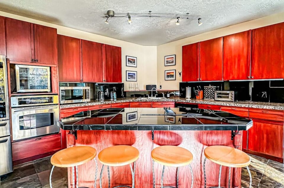 The fully equipped kitchen is a chef`s dream, featuring modern appliances and ample counter space.