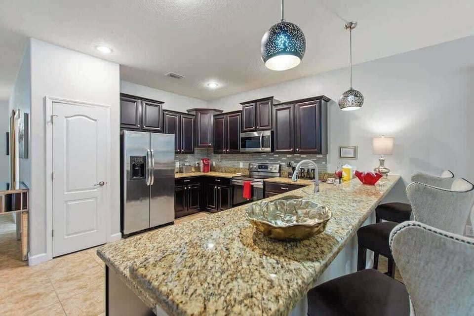 Gather around the breakfast bar for coffee, conversation, or a quick bite before heading to the parks