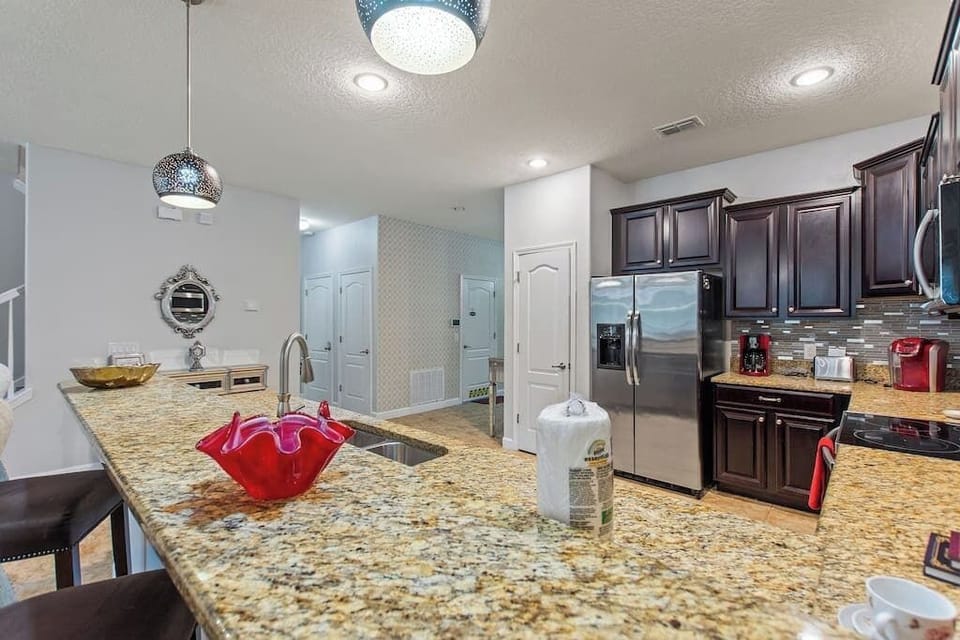 A stylish open-concept kitchen with sleek finishes, perfect for entertaining family and friends.