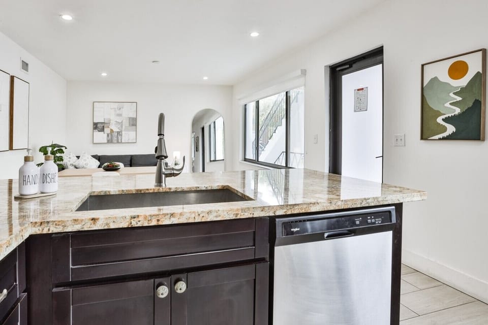 The open kitchen keeps everyone connected while meals are prepared.