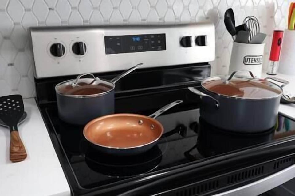 Lots of beautiful pots and pans (more in the cabinet)