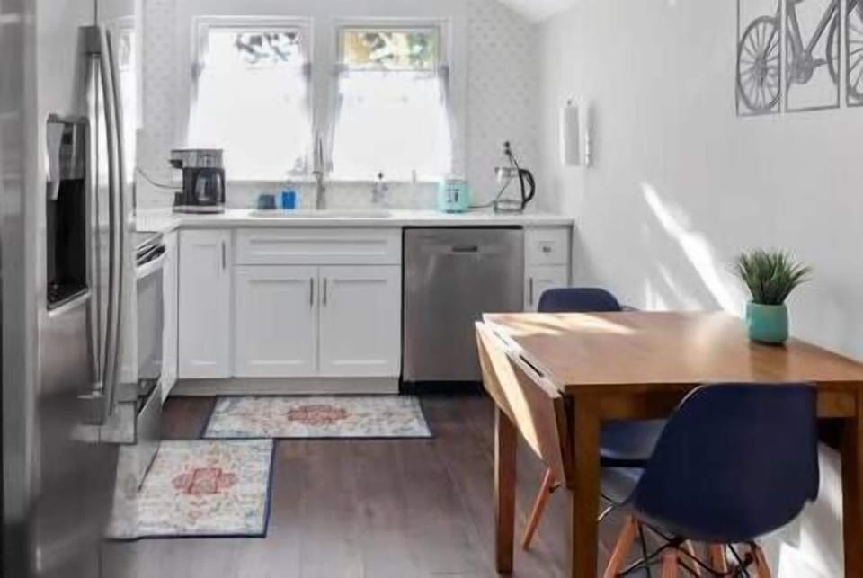 The kitchen and dining table. The table leaves fold out for more eating space.