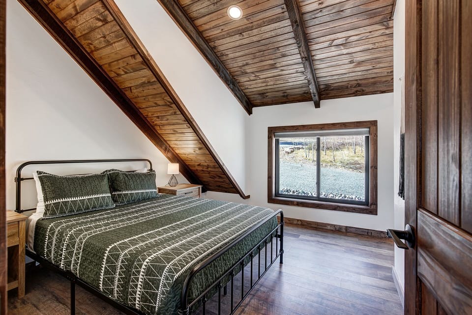 The ensuite bathroom is located down a private hallway to the right [Spare Bedroom, Upper Level]