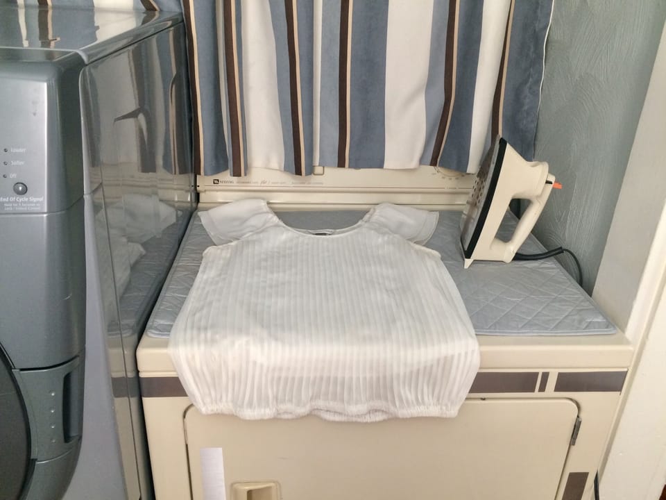 Iron and ironing mat are provided.