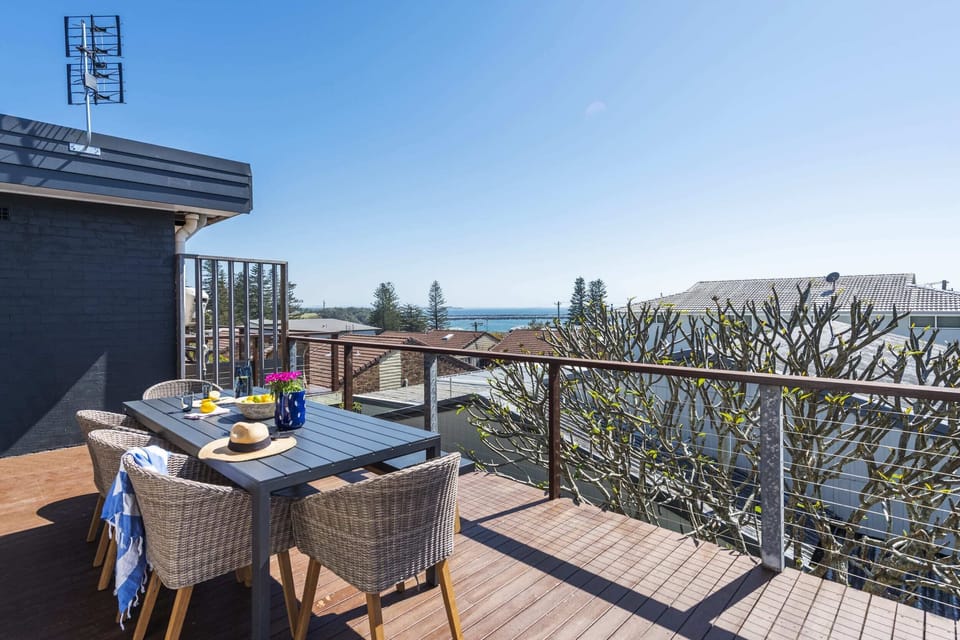 Bimbajong Pines - Coast accommodation in Yamba town with Ocean views - Upstairs balcony with ocean views, barbeque & 8 seater dining set
