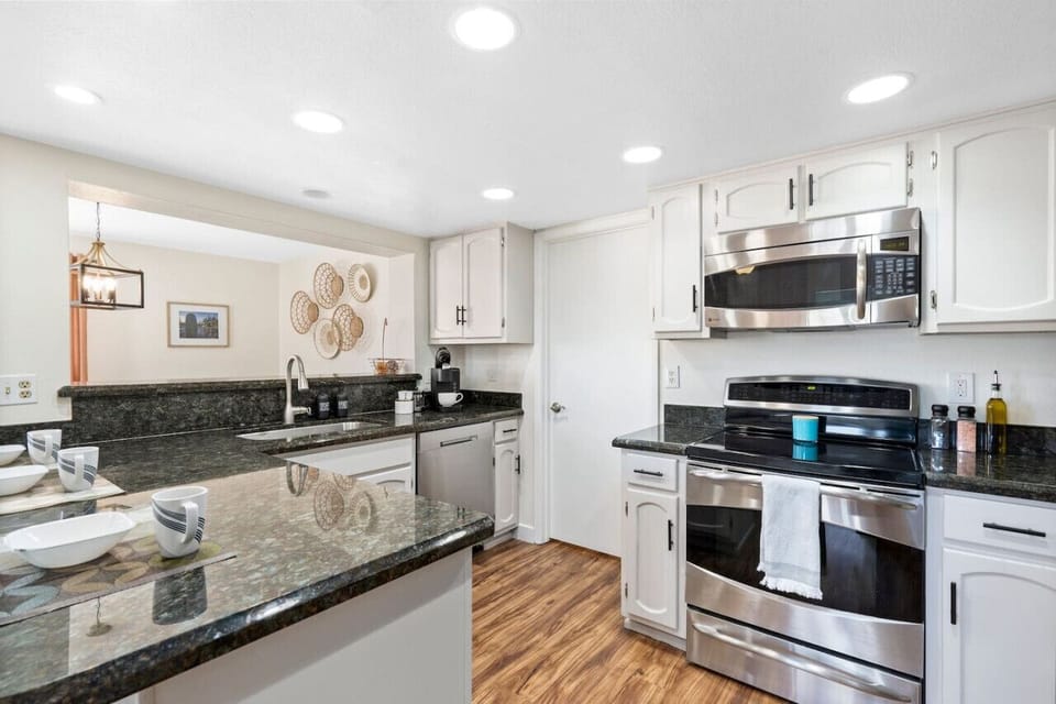 Sleek countertops and modern appliances await your culinary creations!