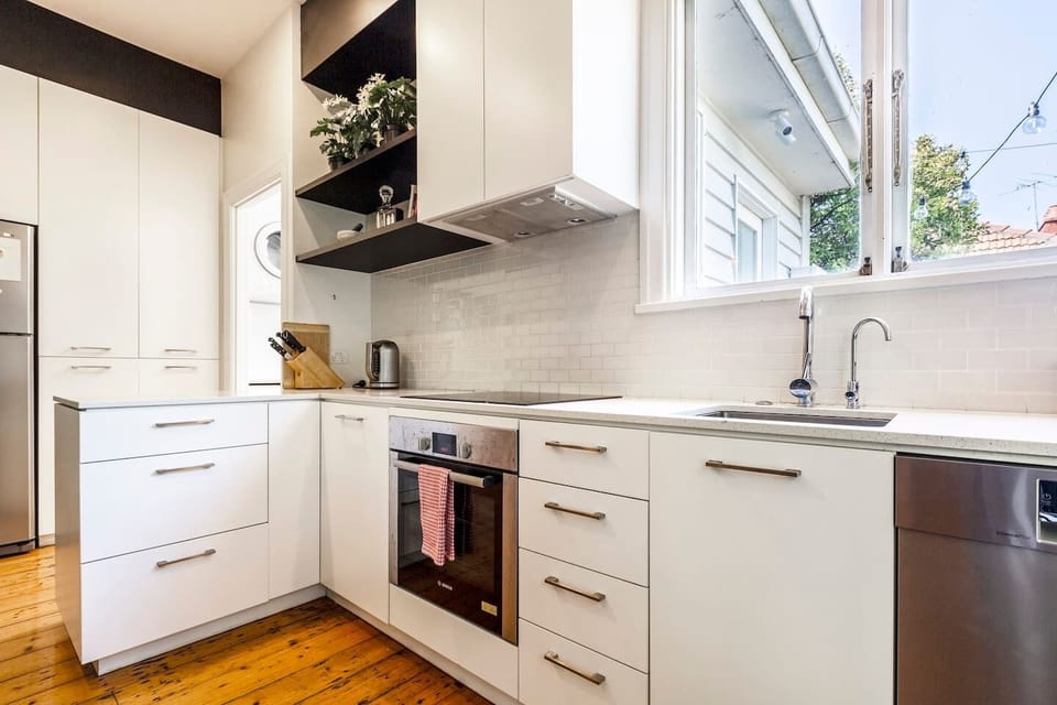 A modern kitchen includes all the essentials needed to prepare meals at home, as well as a dishwasher for easy clean-up. 
