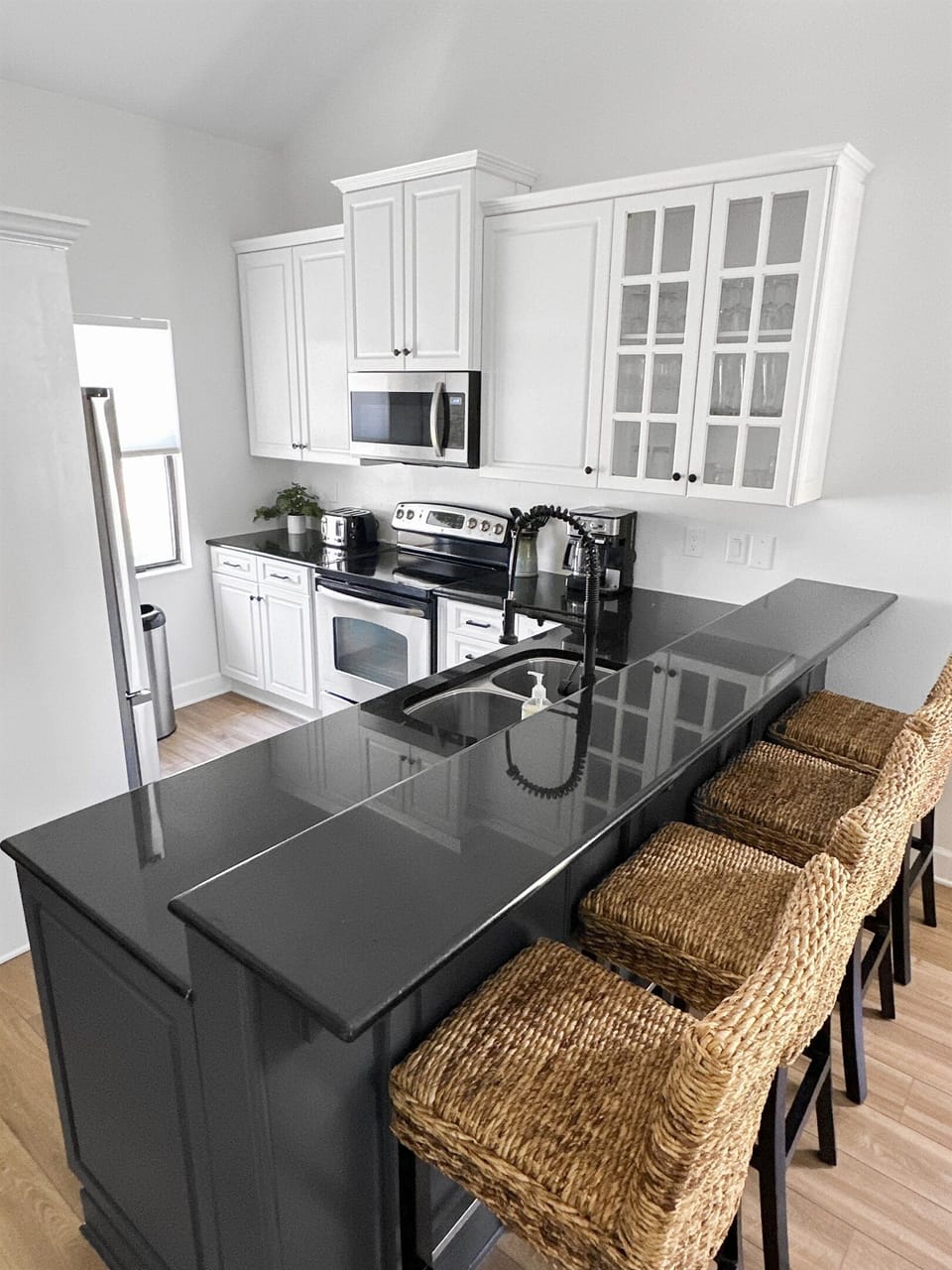 In addition to the dining table, we have 4 comfortable bar stools at the kitchen counter.