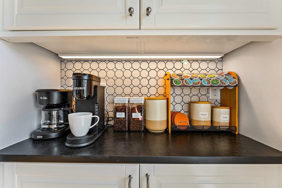 Indulge in the kitchen's dedicated coffee bar, stocked with creamer, sugar, honey, and syrups. "I loved the fully stocked coffee bars in both the kitchen and the kitchenette." Hunza