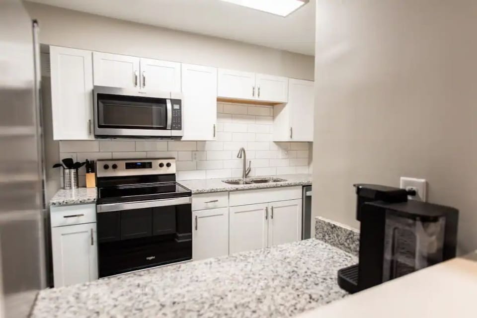 Updated galley kitchen with stainless steel appliances