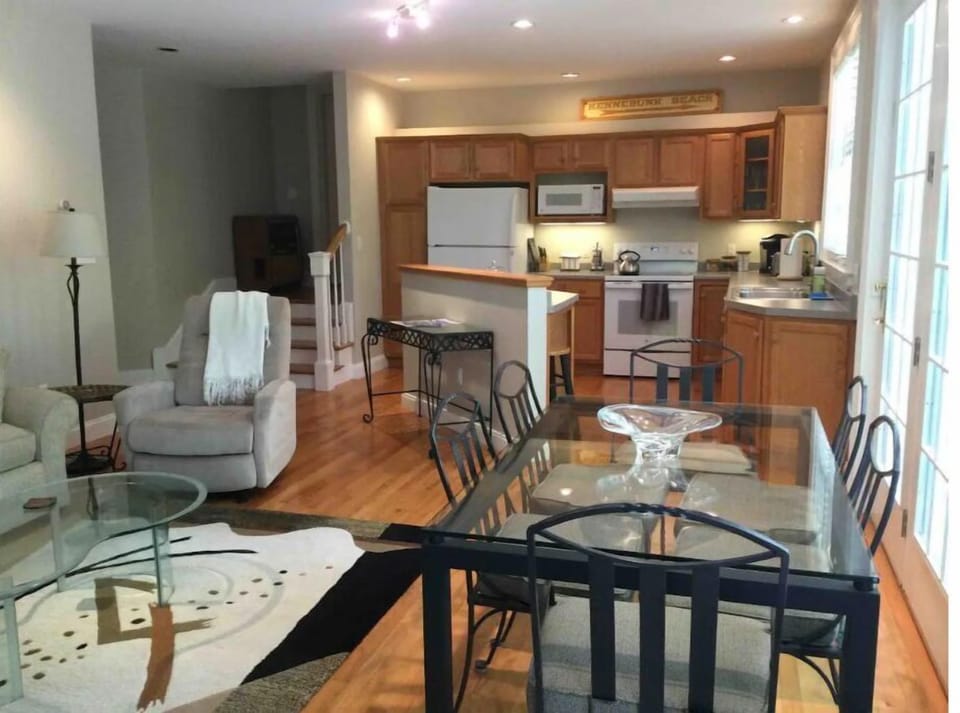 Dining area looking into full kitchen.
