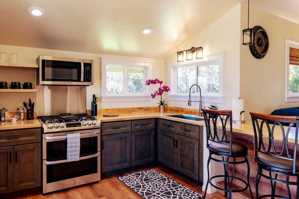 Fully stocked kitchen, wooden countertops, double oven, microwave, grounds or K-Cup coffee maker