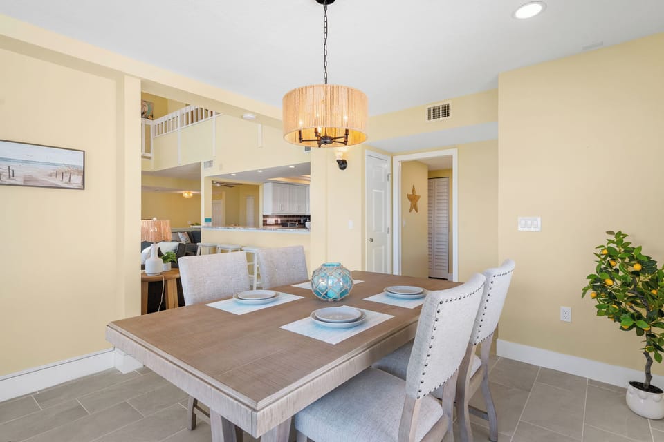 Gather around your spacious dining table with warm pendant lighting and open sightlines to the kitchen for effortless entertaining.
