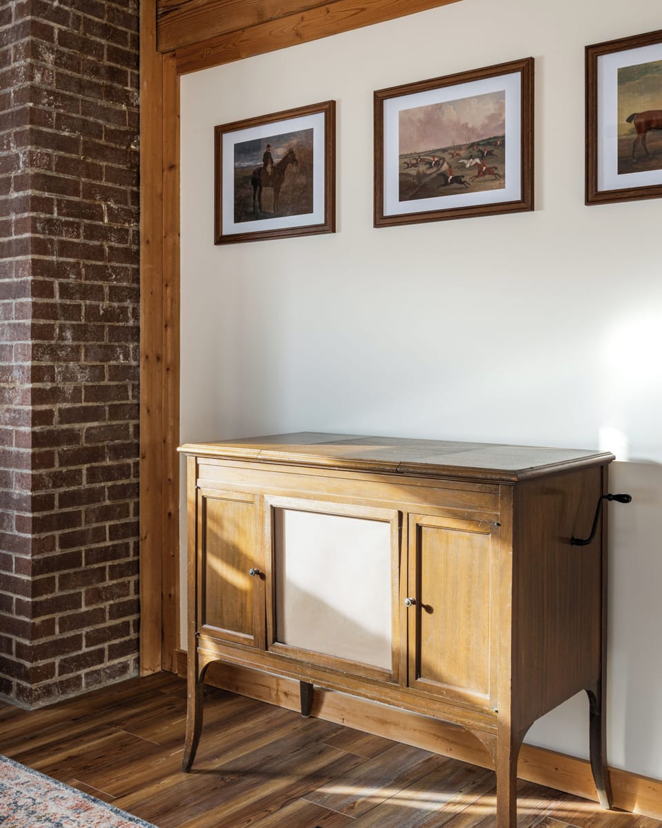 Rustic vintage sideboard with exposed brick and warm natural light