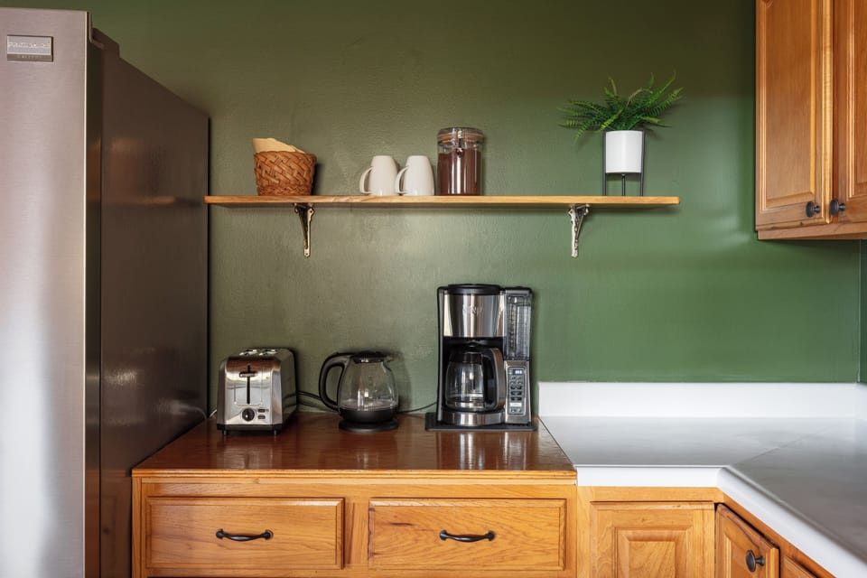 Cozy coffee station with spacious counters and warm wood finishes