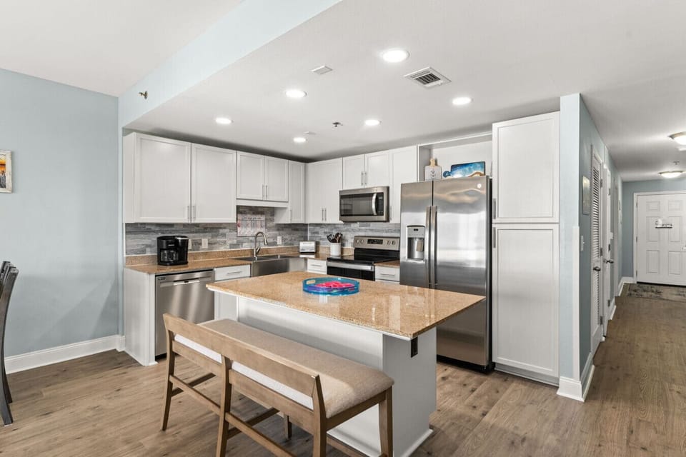 Fully Stocked Kitchen with Ocean Views, Dual Coffee Maker & Island Bar Seating