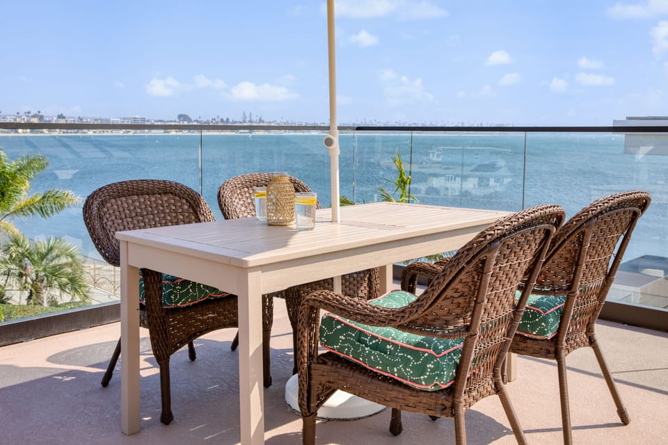 Al fresco dining at a shaded outdoor table on the rooftop terrace.