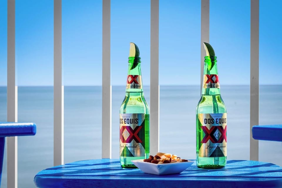 Cheers to breathtaking ocean views! Savor refreshing drinks and snacks on your private balcony as the sea breeze and endless blue horizon set the perfect vibe for your getaway. Relax, unwind, and enjoy every moment of this seaside retreat.
