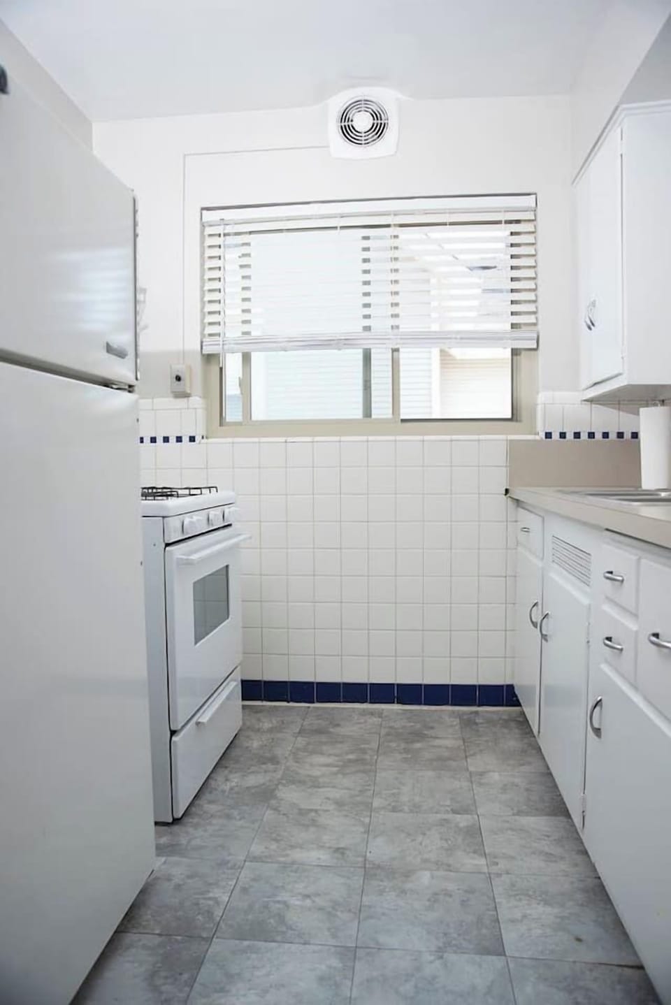 Fully stocked kitchen with microwave.