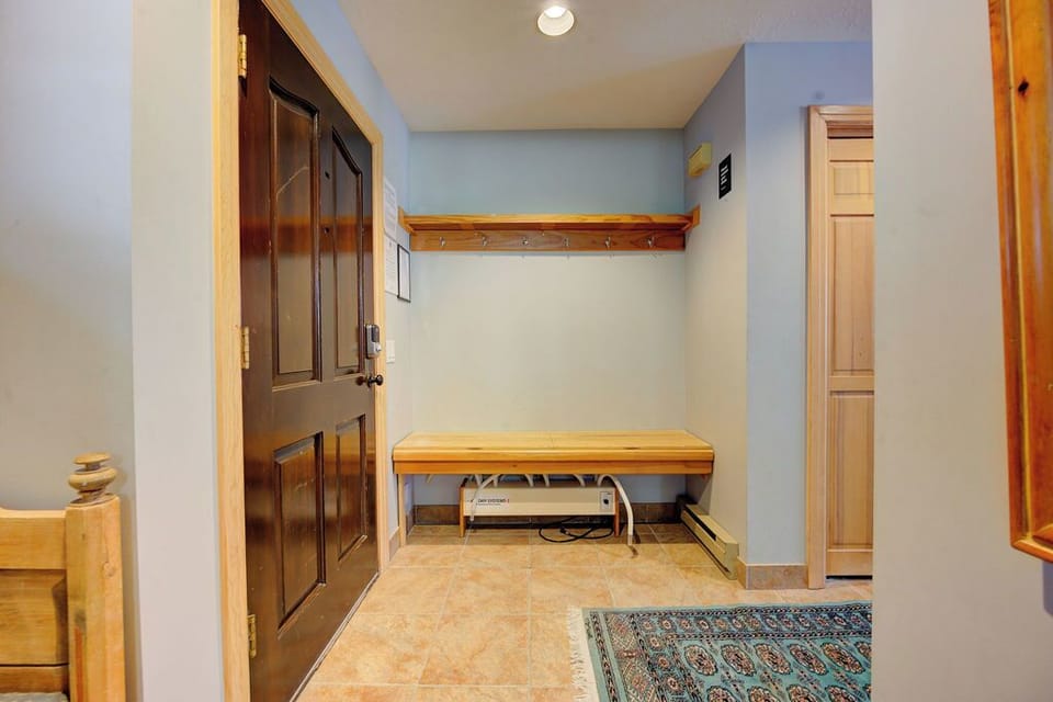 Your own private entry area with built-in storage bench and coat hooks makes coming home feel effortless.