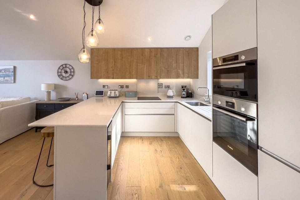 The modern kitchen, finished with white gloss units 