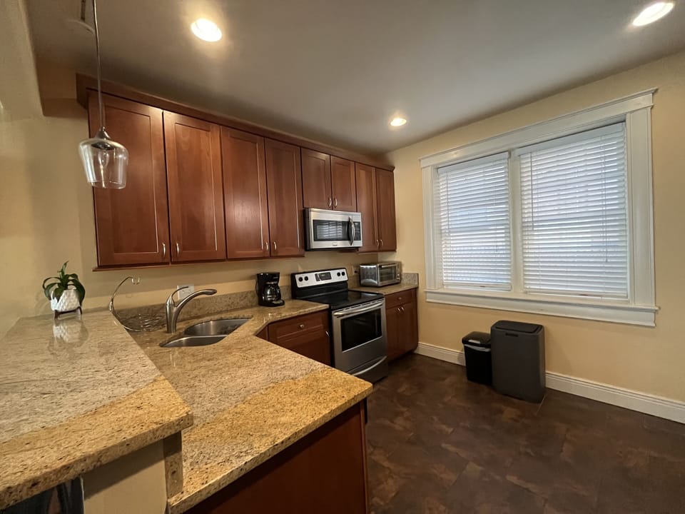 Fully equipped kitchen with modern appliances and plenty of counterspace to cook