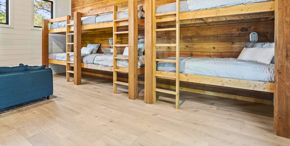 The ultimate bunk room experience! Bedroom 7 features an array of single beds ready for storytelling and late-night chats."