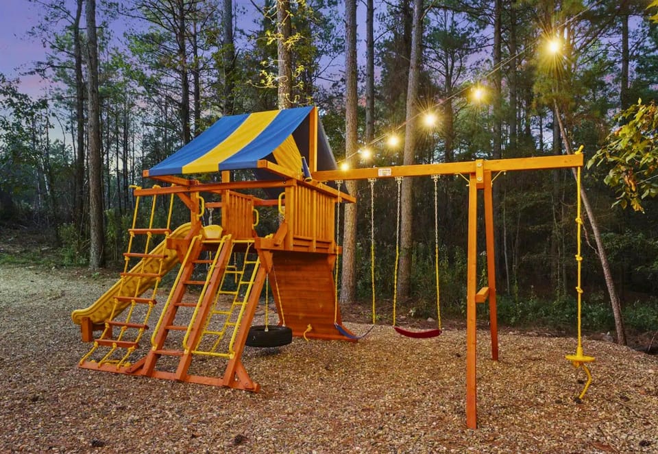 Adventure awaits the little ones in our vibrant backyard playground, a place for giggles and endless play under the fairy lights.