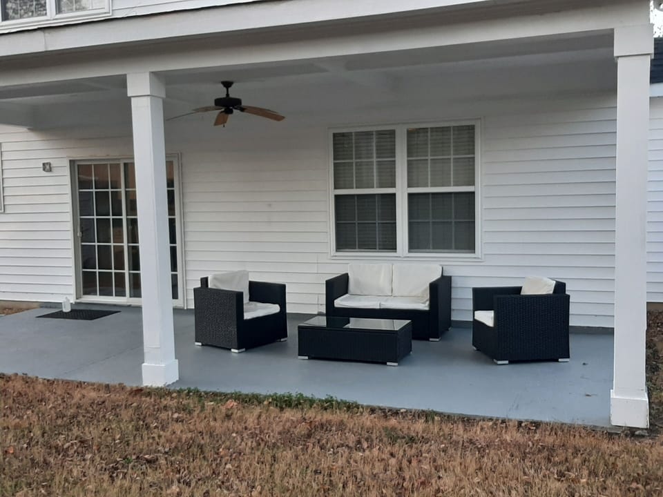Covered back patio, with lots of seating. There is more than what shows here.