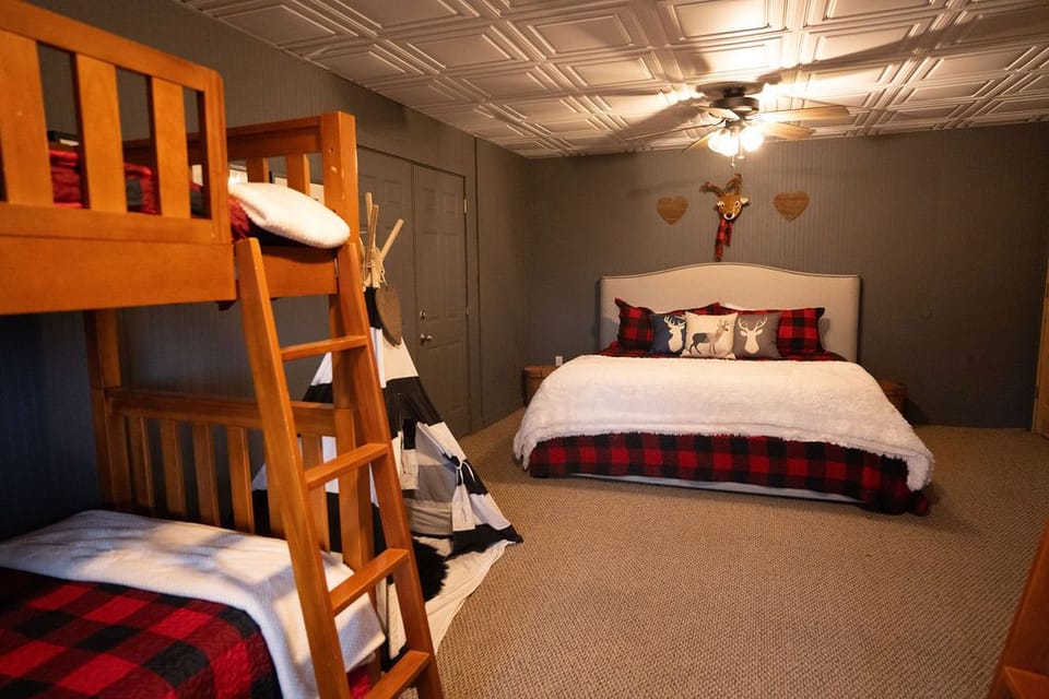 Bunk room in basement  with king bed