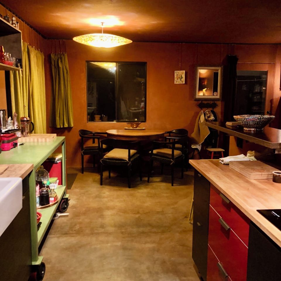 kitchen and dining on east side of home, light fixture by Mush LA