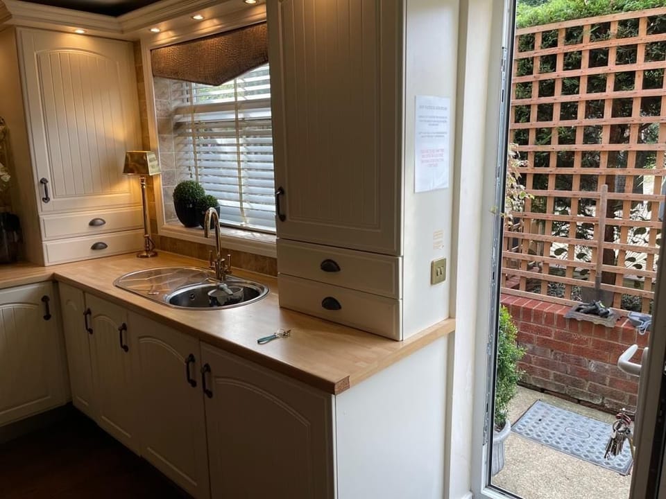 Kitchen with dining table and everything needed - all kitchen appliances, utilities etc 
6 ring gas cooker 