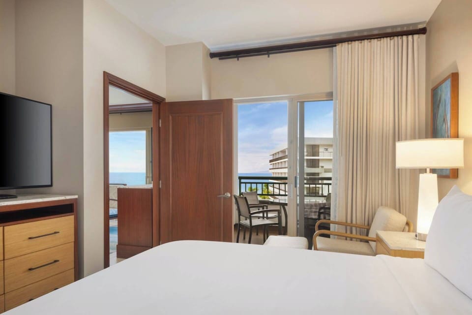 Primary Bedroom features a king bed and ensuite full bathroom (Ocean View - View May Vary).