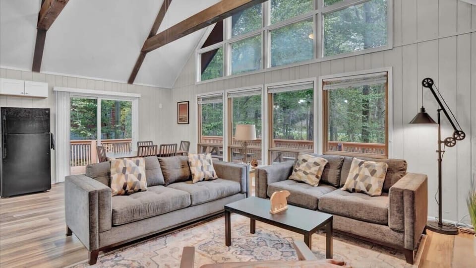 Spacious Living Area with Vaulted Ceilings & Large Windows