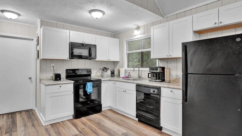 Fully Equipped Modern Kitchen with Stainless Steel Appliances