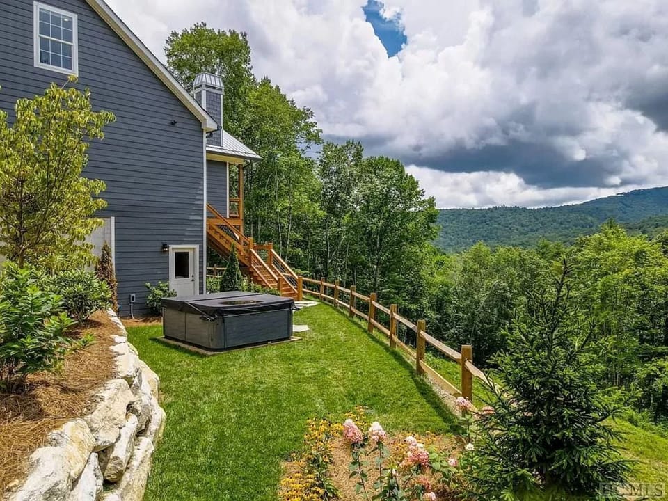 side of the house with 9-person spa 