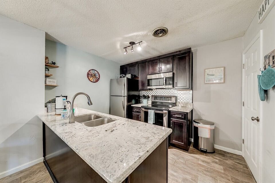 Kitchen with electric range & refrigerator