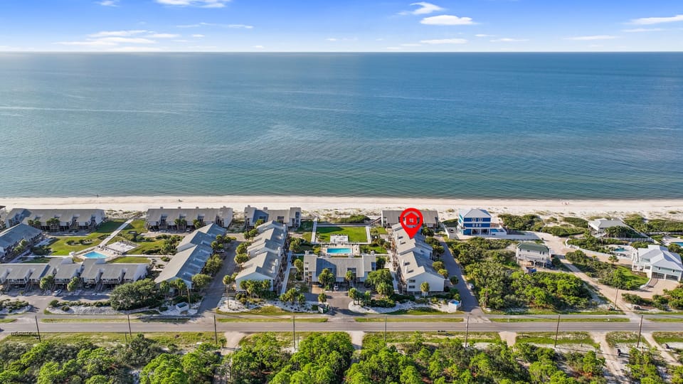 Enjoy beachfront living and pool side views!