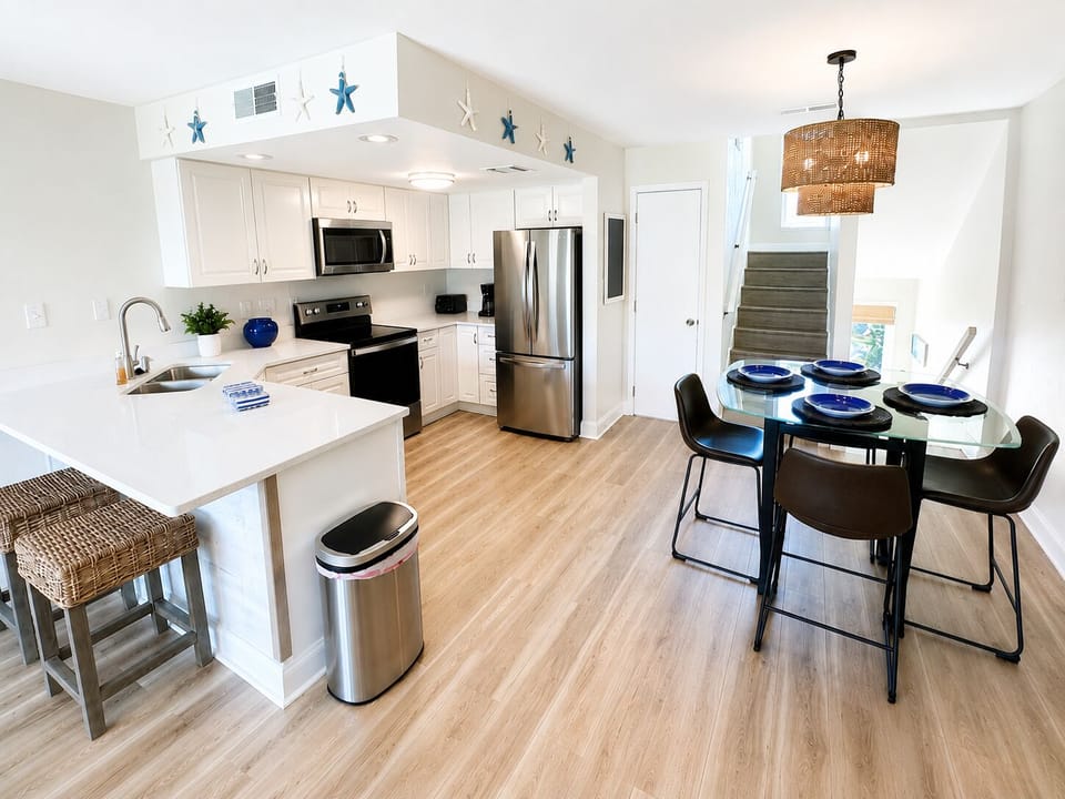 Fully equipped kitchen with stainless steel appliances.