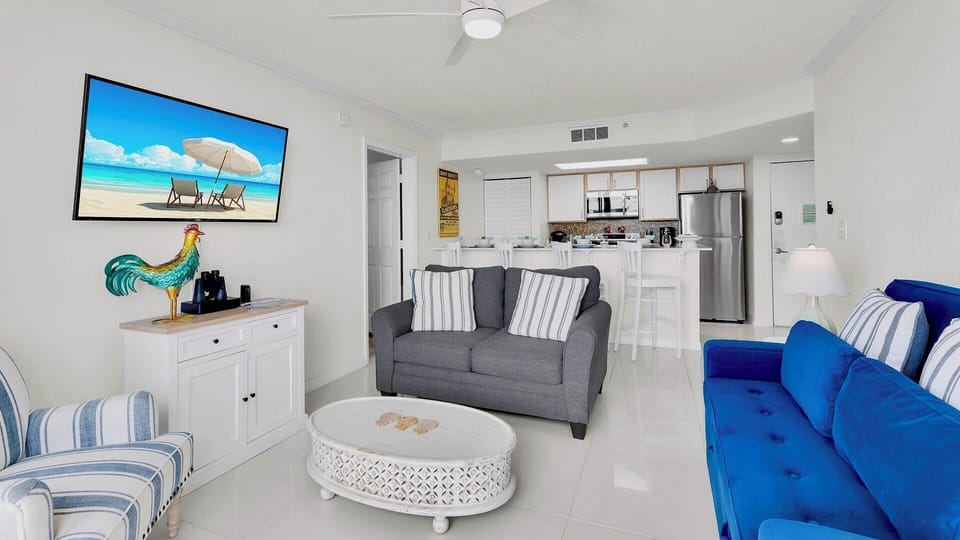 Unwind in your bright coastal retreat with plush seating, coastal décor, and a modern kitchen ready for your culinary adventures—vacation mode awaits!