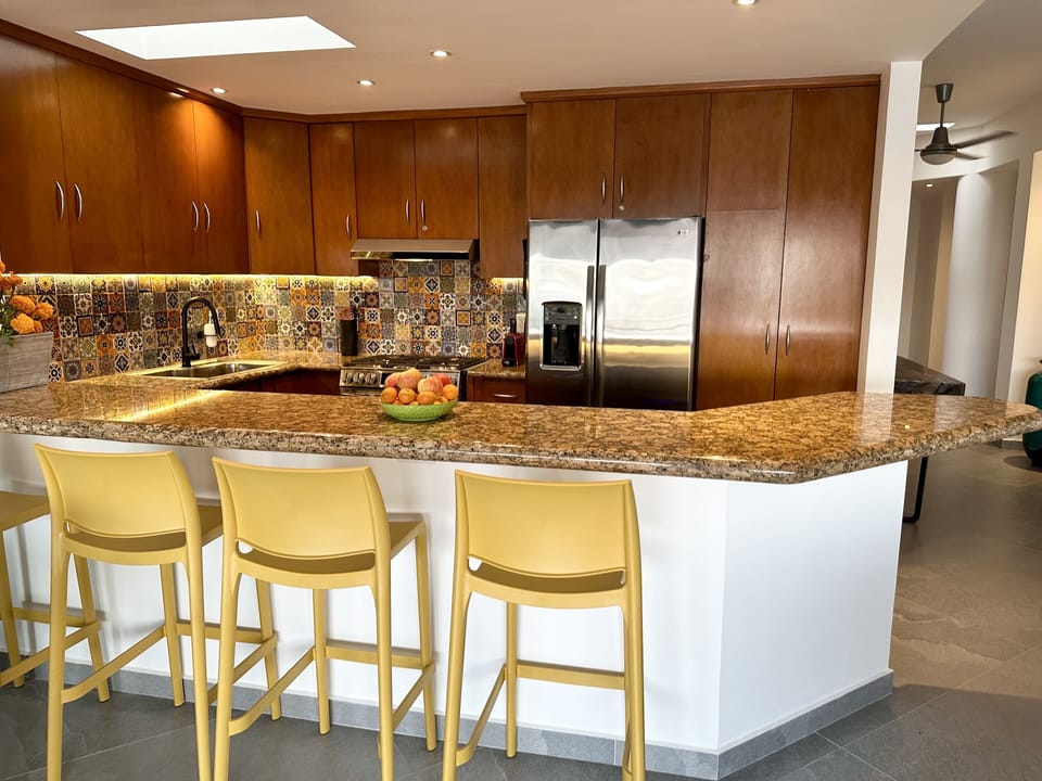 Well-equipped kitchen w/ new 5-burner gas stove/oven, dishwasher & wine fridge.