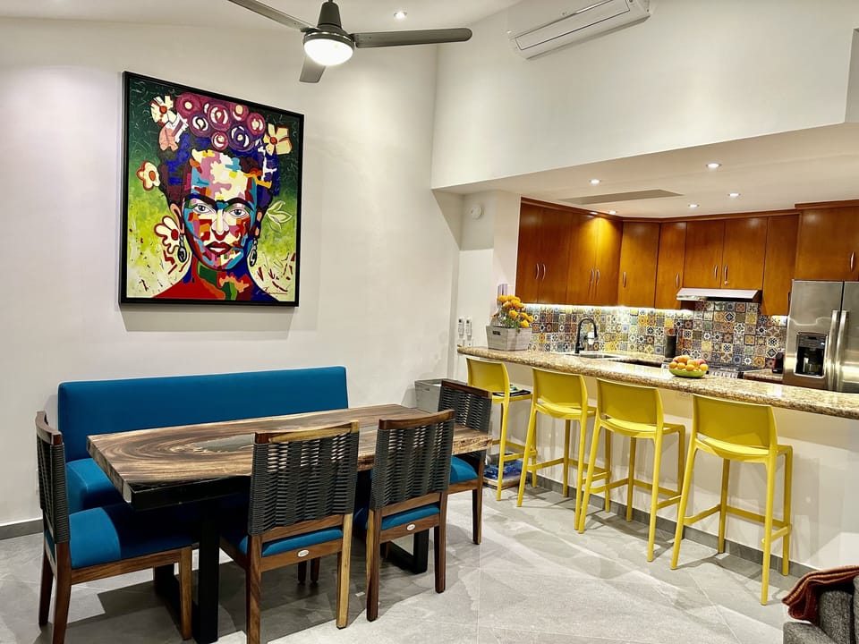 Dining area perfect for entertaining dinners around hand-crafted parota table.