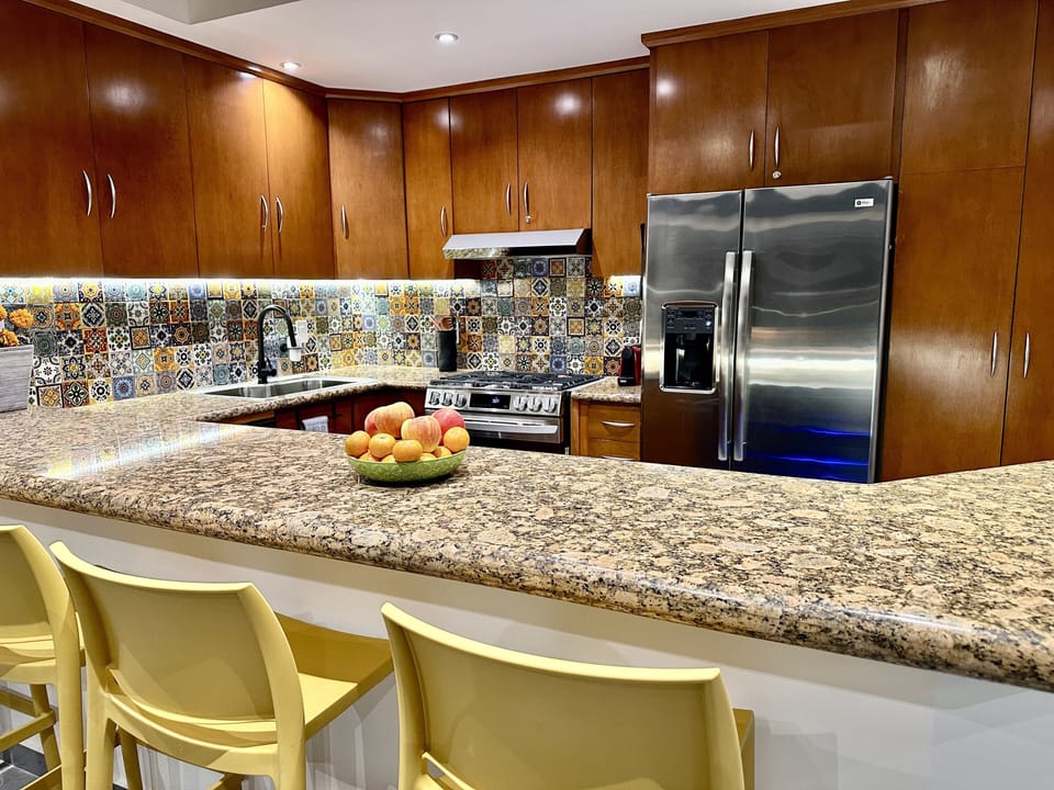 Well-equipped kitchen w/ new 5-burner gas stove/oven, dishwasher & wine fridge.